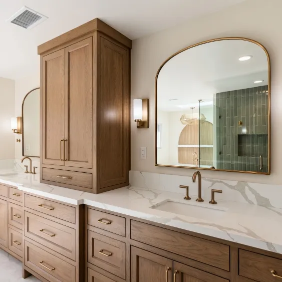 San Diego primary bath remodel with a double wood vanity, quartz countertop, arched mirrors, and storage tower