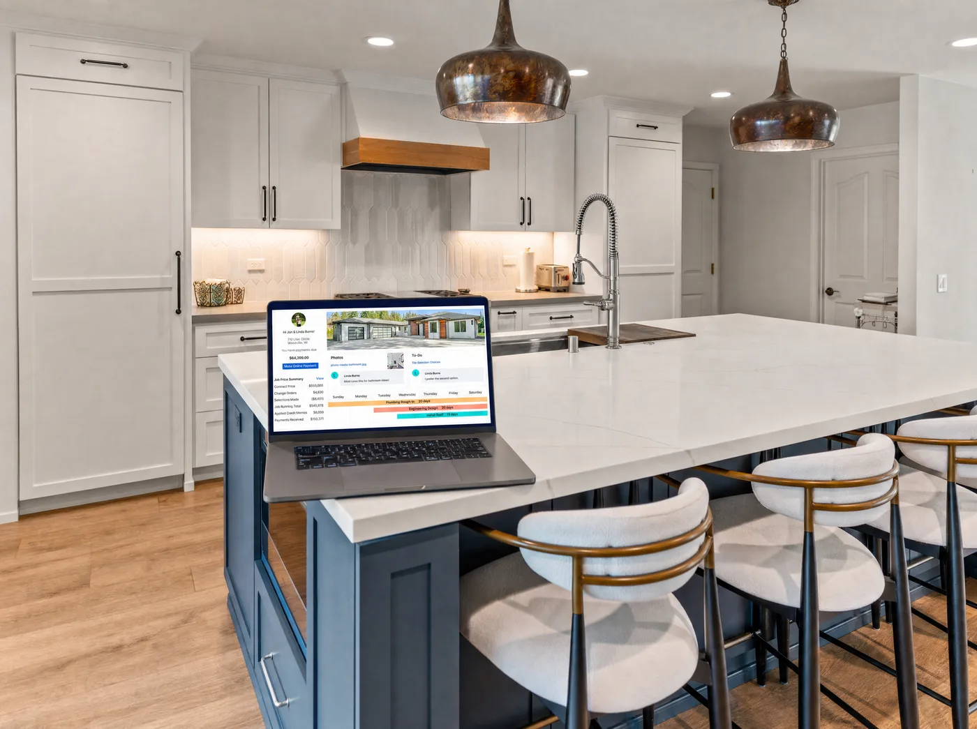 BuilderTrend client portal displayed on a laptop in a completed Lars kitchen