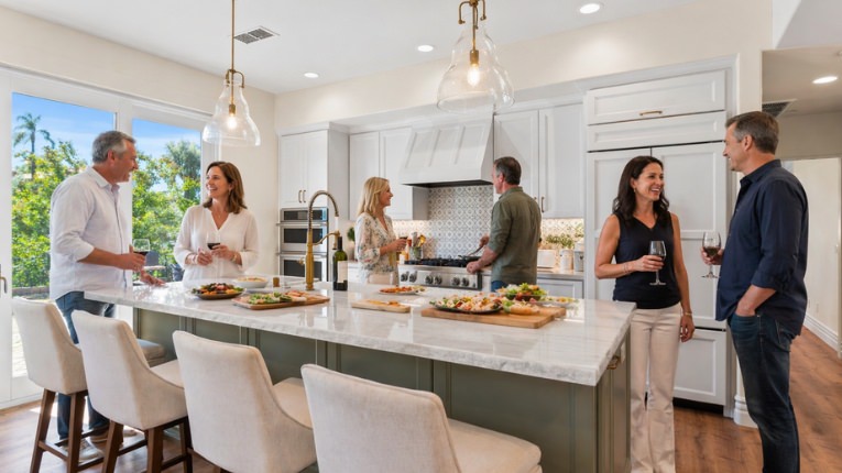 Homeowners gather in a newly remodeled San Diego kitchen.
