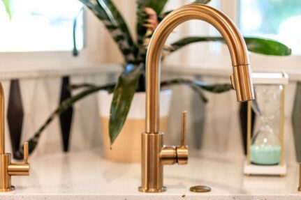 Custom kitchen remodeling detail featuring premium brushed brass fixtures, highlighting how thoughtful material selections and finishing touches contribute to a cohesive, high-end design.