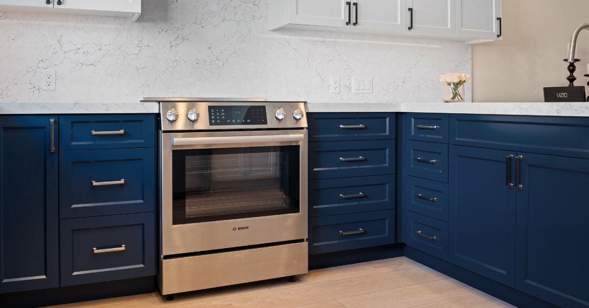 Modern kitchen with painted blue cabinets, quartz countertops, and eco-friendly interior finishes that support healthier indoor air quality.