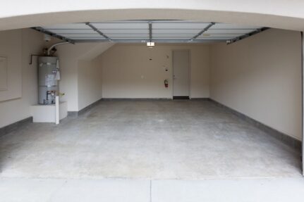 Spacious garage ready for organization featuring open floor space, clean walls, and storage potential for tools, equipment, and household items.