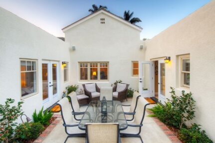 Beautiful courtyard addition featuring soaring architectural lines, enhanced ceiling design details, outdoor entertaining space, and seamless indoor-outdoor flow that elevates both the home's character and functionality.