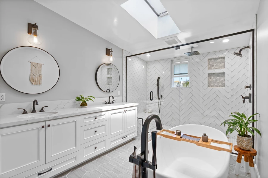 Opened skylight over a remodeled white bathroom