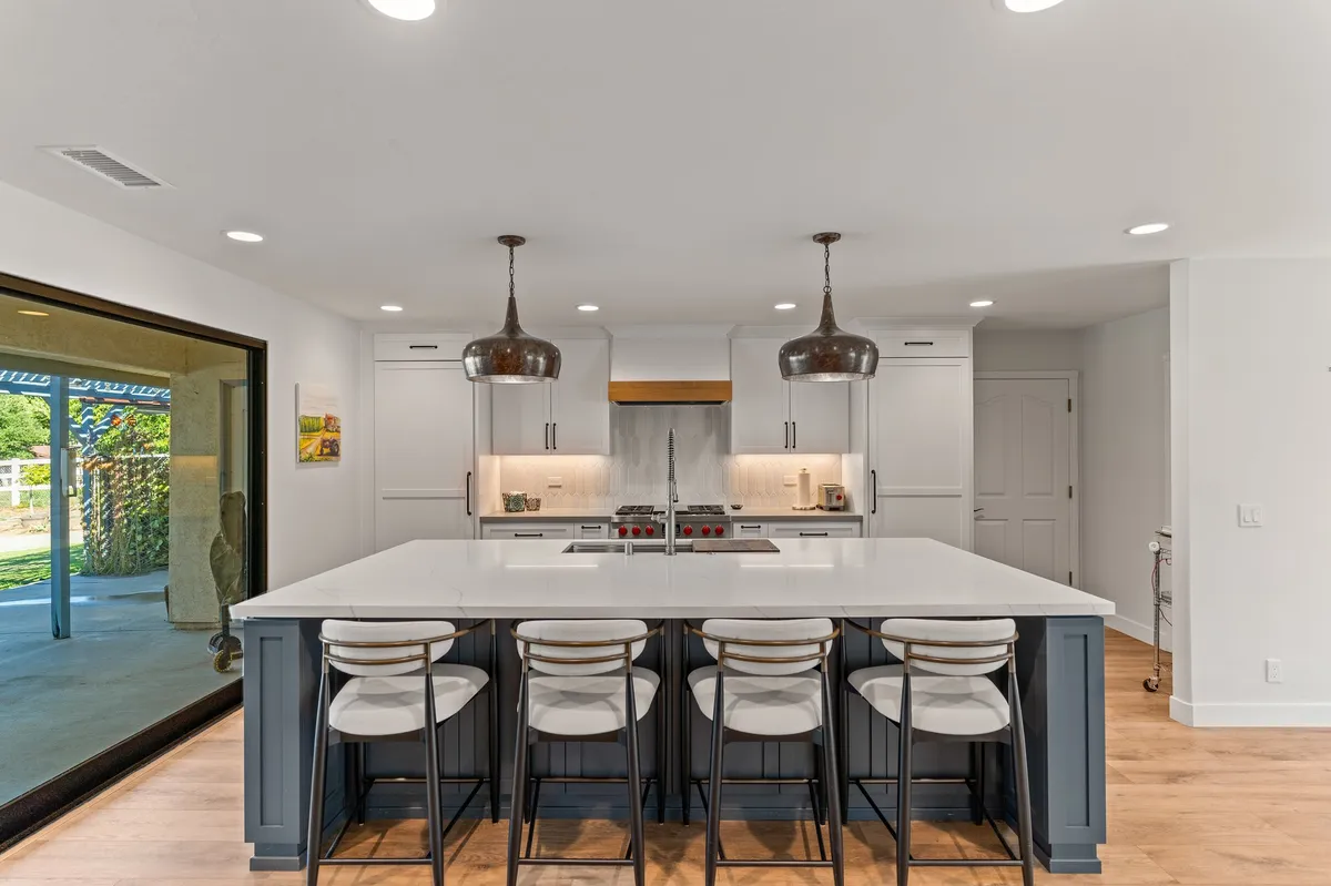 White modern kitchen with a large kitchen island