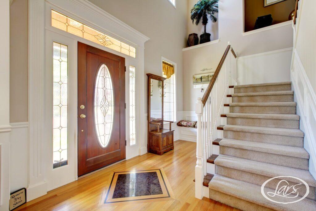 When it comes to the look and feel of your home, first impressions are just as important as they are in other aspects of life. If you can make your guests feel a warm, welcoming atmosphere as soon as they step through your front door, they’ll automatically take these positive feelings with them into the other areas of your home. In order to spark your imagination and help you create the ideal entryway that packs both style and function, we prepared a list of 7 color ideas for a sunny and inviting foyer. Keep reading to learn more! What are the best colors for an entryway? Whichever hue you choose, it goes without saying that it should fit the rest of your interior decor. If you can’t decide which color to go for or how to combine different shades, don’t hesitate to reach out to a trusted house renovation company and consult with the pros directly. Here are 7 great entryway colors you can’t go wrong with: 1. Crisp, clean white Whether you have a small or large space, pristine white hues are always a good choice. The bright surfaces reflect both natural and artificial light, creating a cheerful and open atmosphere that can be further enhanced with all kinds of ornaments. 2. Soft pink Want to add some color, but not make the space look too intense or dark? A soft pink hue can give the foyer a romantic touch that’s just subtle enough to create a welcoming transition while also adding a bit of depth. 3. Light, organic green This earthy green hue is the perfect option if you live in an area where the weather is often cool and overcast, as it gives the space some freshness and comfort. It has the added advantage of getting along really well with many other colors. 4. Neutral gray Gray has been a beloved foyer color for a long time, and it’s easy to see why. It can be combined with both darker and brighter accent colors, while also working well with other shades of gray such as slate, pewter, or lead. If you prefer a more luxurious look, you can combine darker gray hues with rich colors like emerald green and wine red. 5. Various shades of beige It’s hard to go wrong with beige. This color adds elegance and sophistication to an entryway without calling too much attention to itself or unnecessarily darkening the space. 6. Aqua blue A bright blue shade is more neutral than other blues, while also giving the space a major beach decor feeling and working really well with various other popular hues. 7. Bright orange An orange front door has a vibe that’s both welcoming and energetic. However, because it's so bold, vibrant orange hues should be used in limited amounts and balanced with large neutral areas. Where can I find the top house renovators in San Diego? Here at Lars Remodeling & Design, we’re a collaborative group of renovation experts, project managers, trade partners, and highly skilled designers who specialize in assisting the good people of San Diego at all stages of their custom home renovation projects. During our 30 years of industry presence, we have remodeled more than 3000 homes and had the distinction of being given the Best Remodeler award for years 2019 and 2020 by the San Diego Union Tribune. Whether you’re planning to extensively renovate your kitchen or just give an old bathroom a facelift, you can count on us to deliver your desired results in a way that ensures maximum longevity and avoids common remodeling pitfalls. Give us a call today!