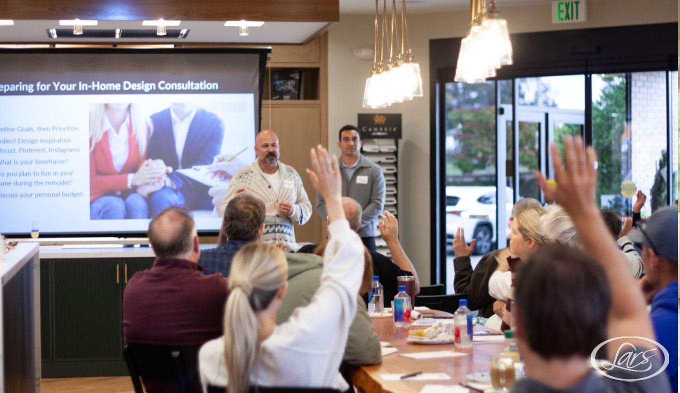 Lars Remodeling experts leading a class on home renovation.