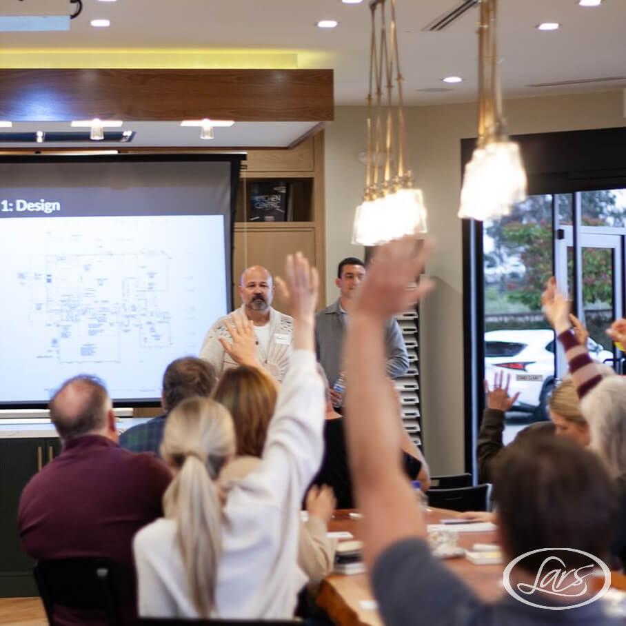 Lars Remodeling experts leading a class on home renovation.