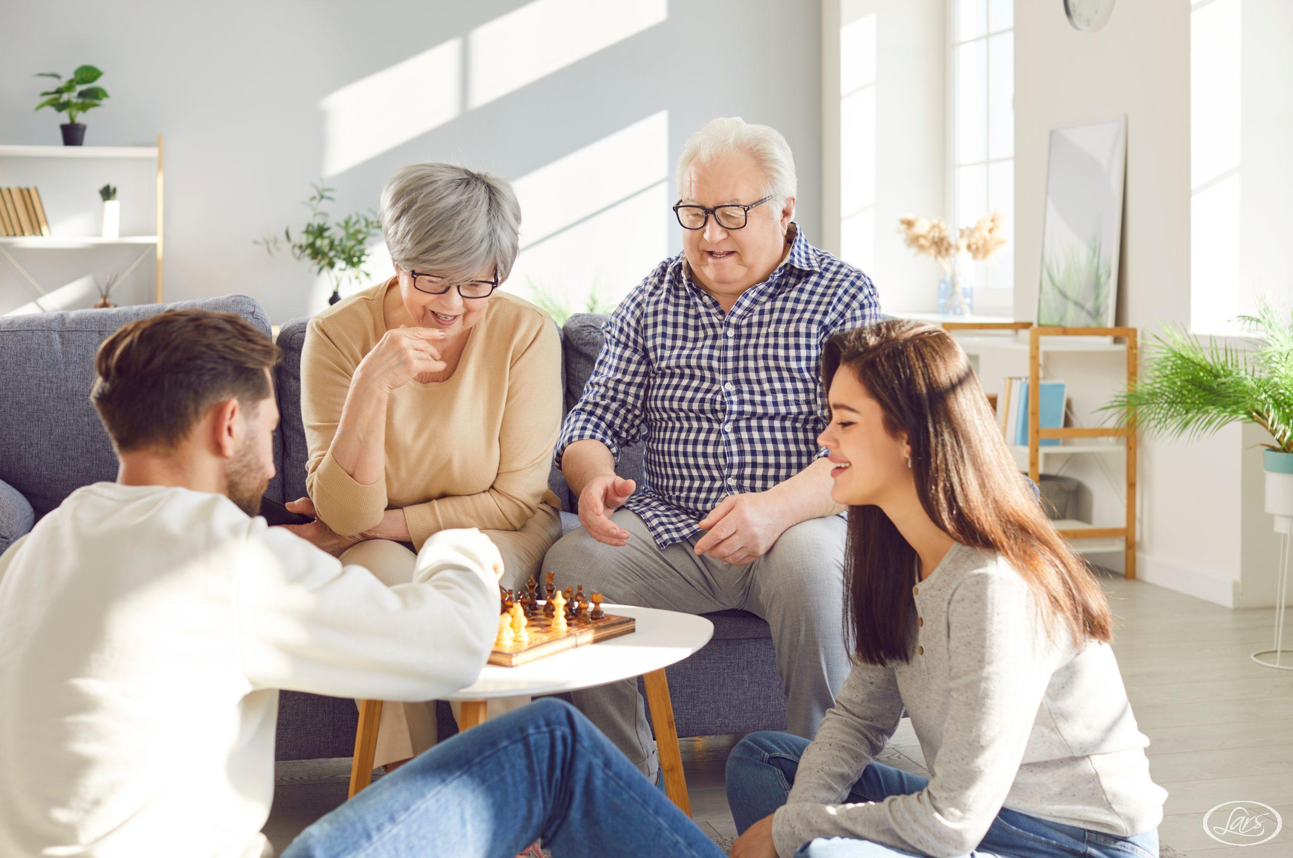 Family Playing Chess Together At Home