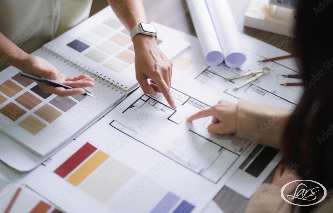 Home remodeling expert and client reviewing a remodeling contract.