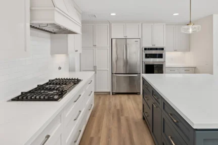 Modern kitchen with while countertops and cabinets