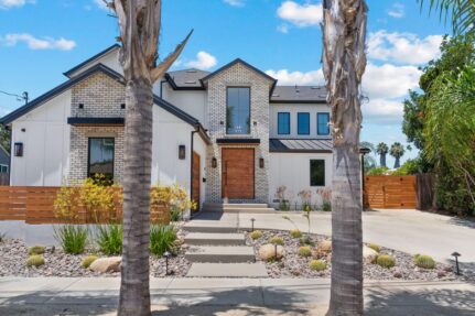 Modern two-story home exterior remodel with clean landscaping and contemporary design in San Diego