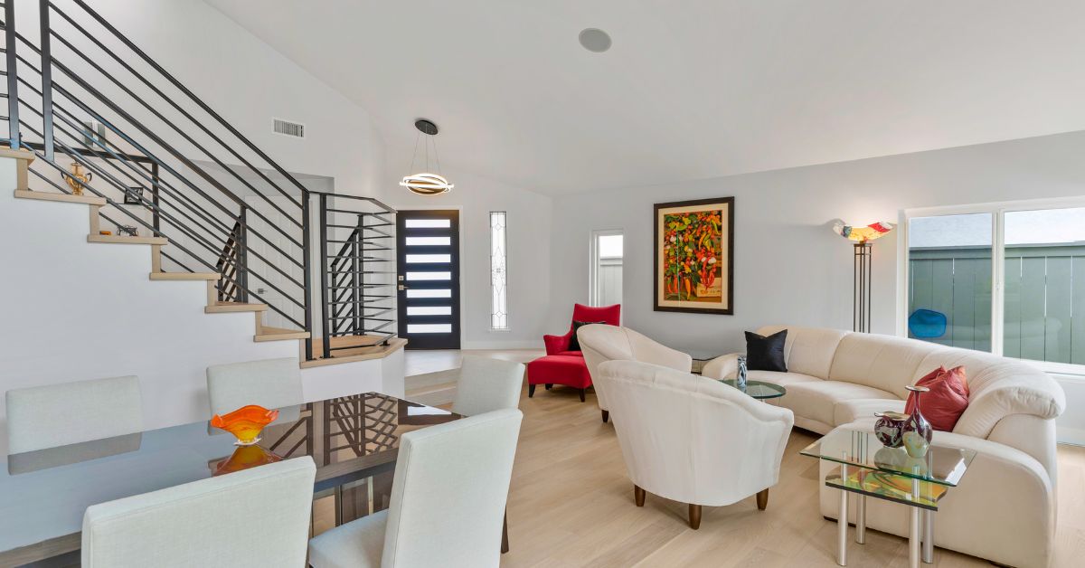 Modern open-concept home remodel in San Diego with custom staircase, contemporary finishes, and professionally designed living space