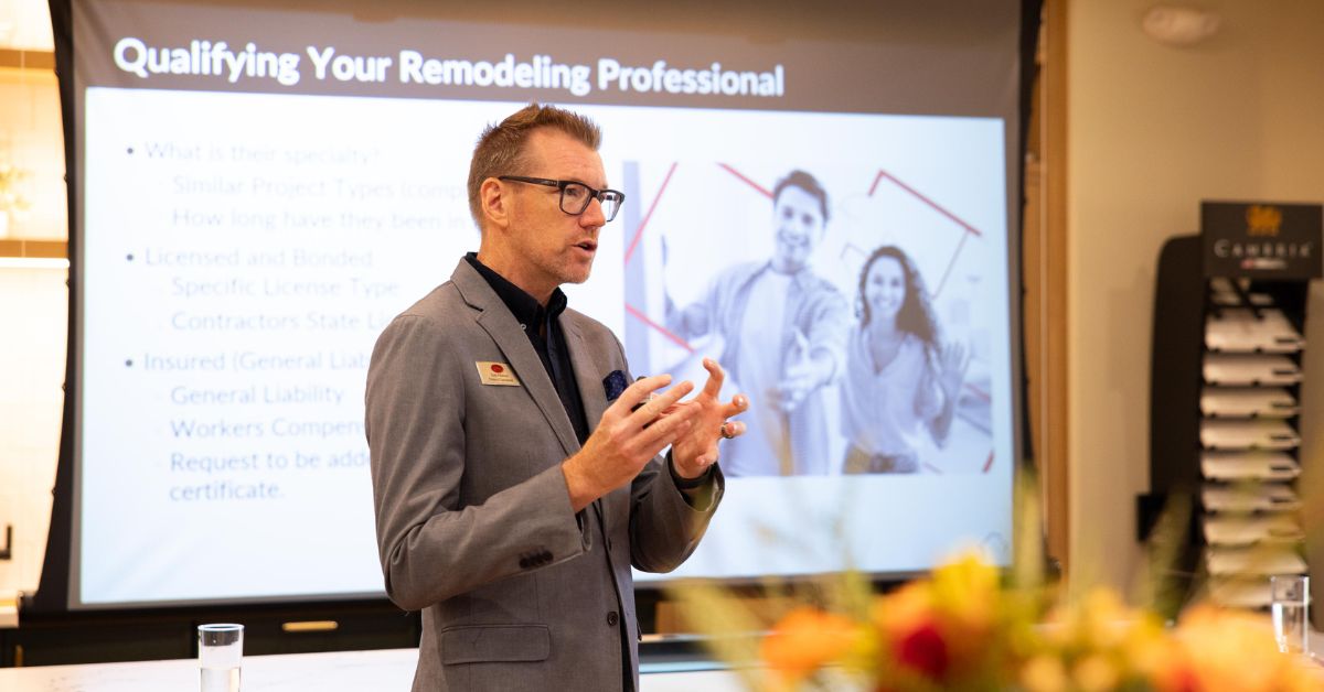 Team presenting remodeling process and contractor qualifications to audience