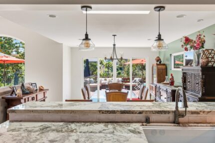 Open-concept kitchen and family room designed to encourage gathering and connection in a multi-generational household.
