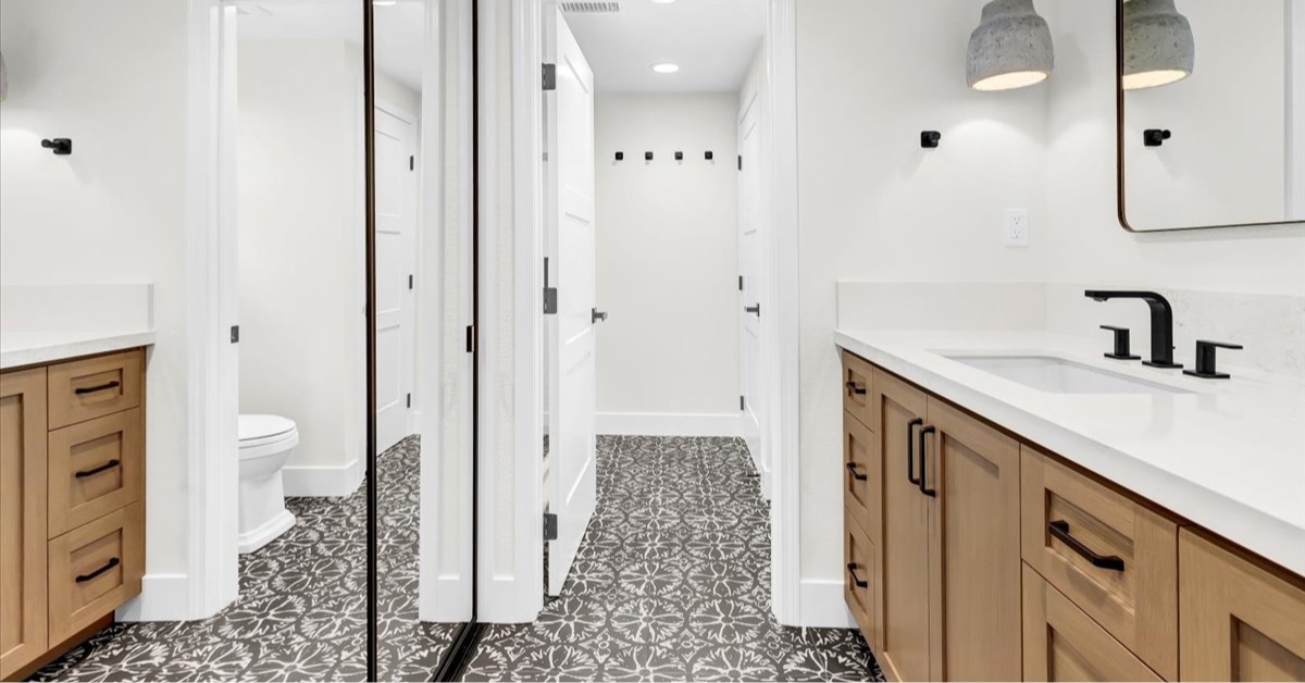 Private bathroom suite within a multi-generational home featuring separate vanity areas, modern finishes, and dedicated personal space.