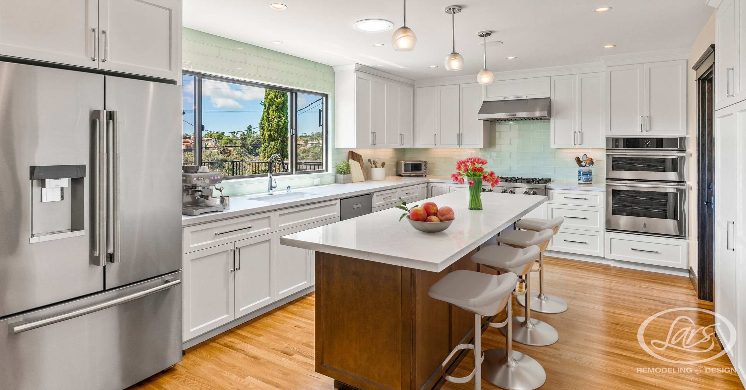 Modern remodeled kitchen and living space with custom cabinetry, natural wood accents, and open-concept design.