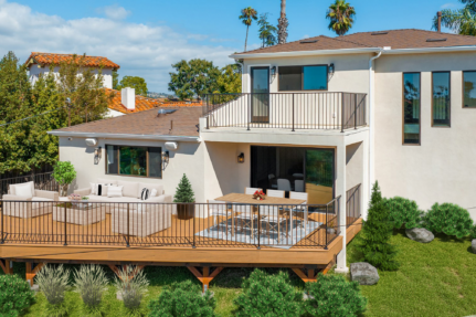 Fully remodeled San Diego home with expanded outdoor living area, elevated deck, modern windows, and custom exterior upgrades.