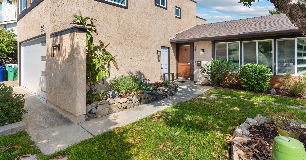 Multi-generational home addition with a separate exterior entrance providing independent access for family members.