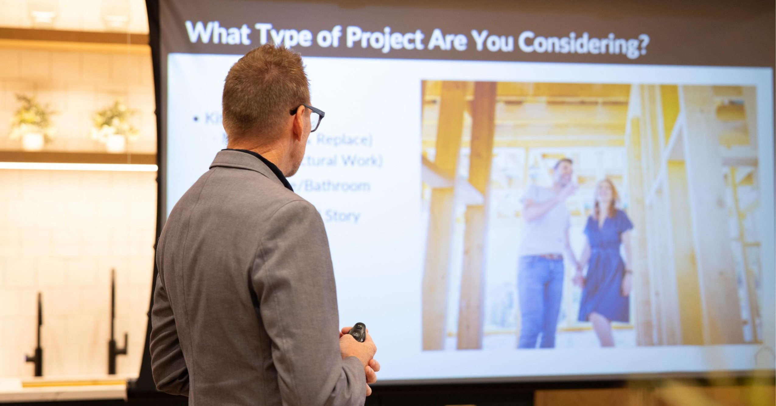 Remodeling professional presenting educational information during a homeowner Educate Before You Renovate Event.