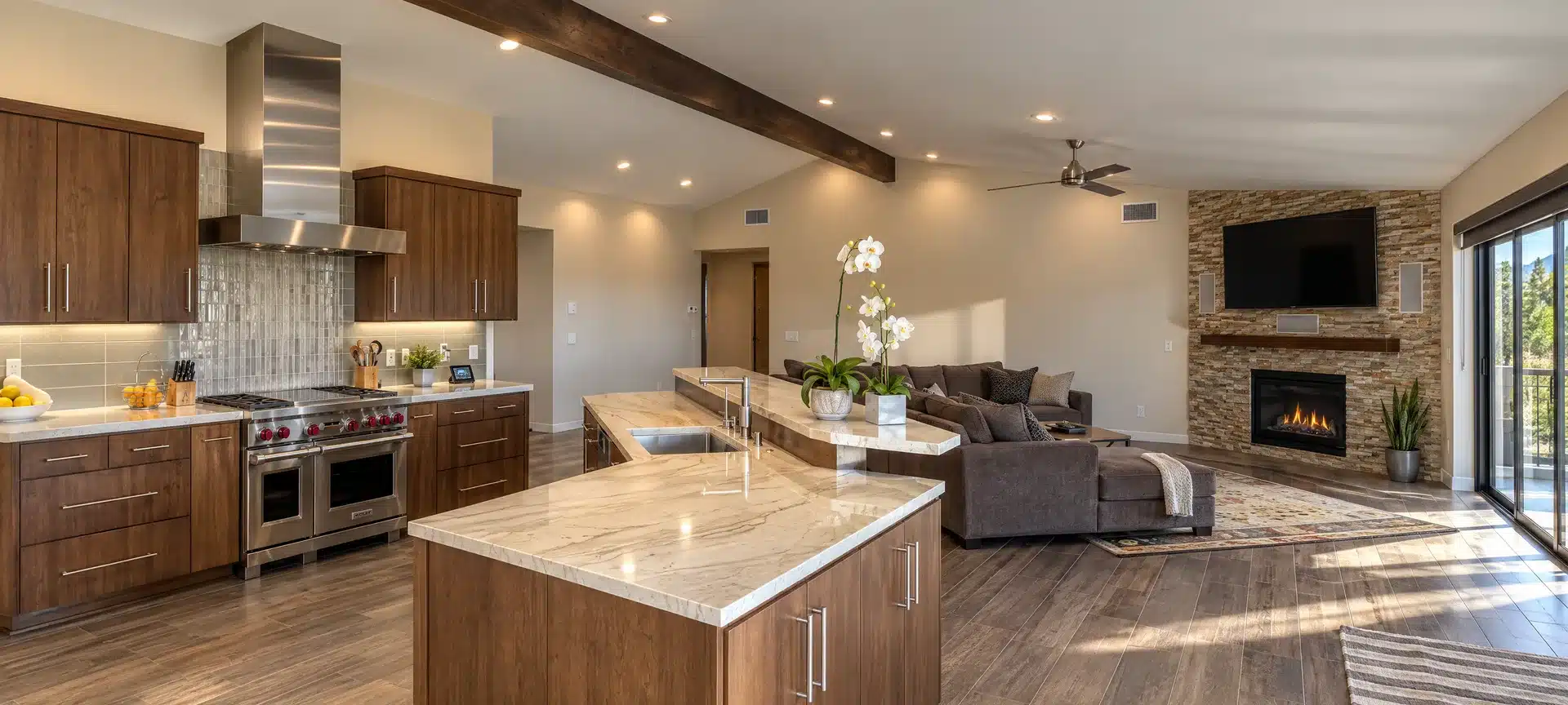 La Jolla whole-home remodel with wood kitchen cabinets and a stone fireplace.