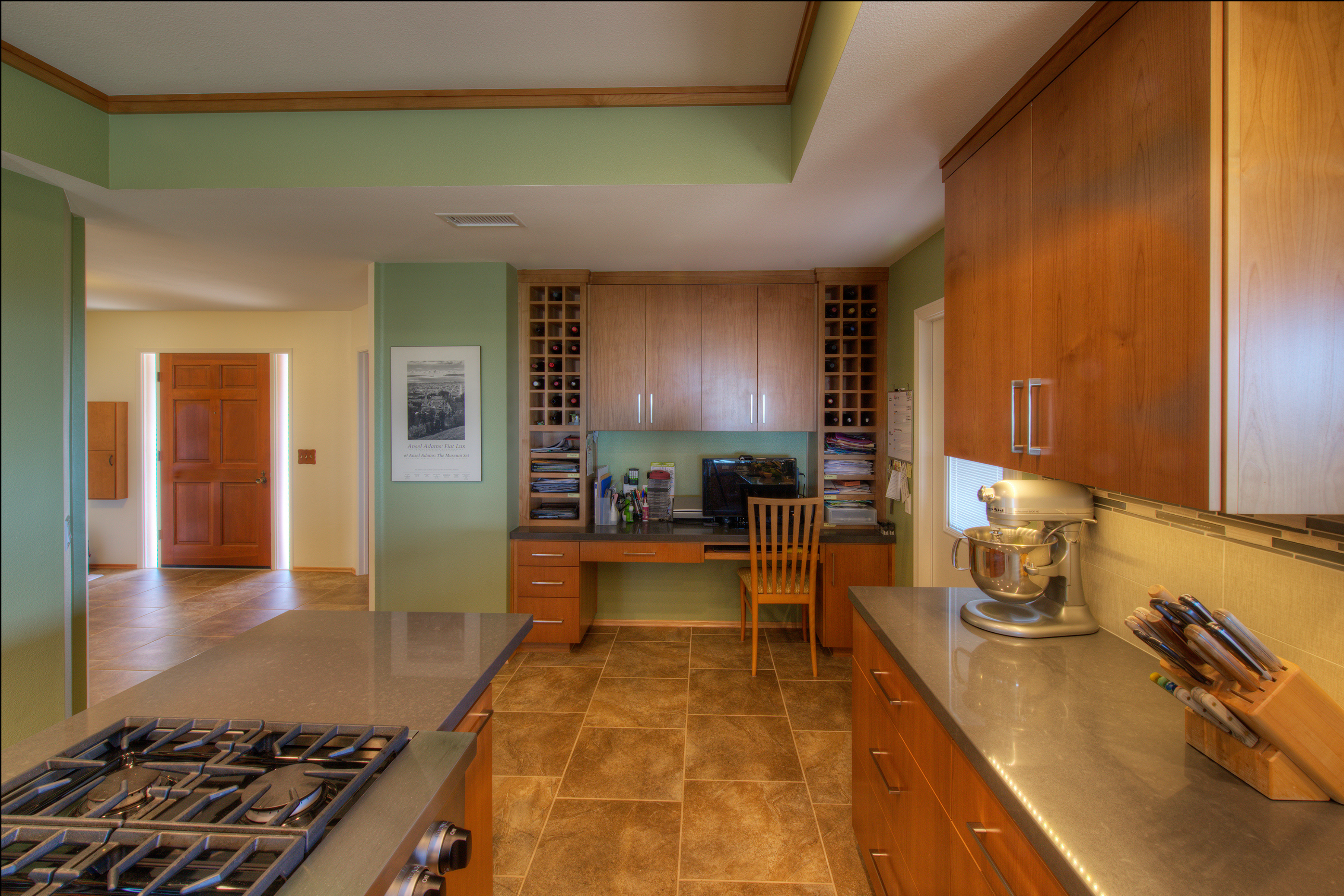 La Mesa remodeled kitchen with alder cabinetry, gray counters, gas cooktop, tile flooring and built-in desk.