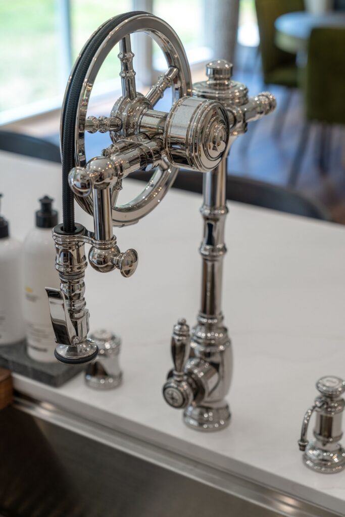 [Chula Vista kitchen sink with polished chrome bridge faucet, white countertop and stainless basin