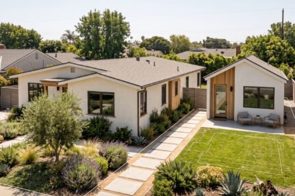 San Diego single-family home with a detached backyard ADU, landscaped walkway, fencing, and subtle property planning lines.