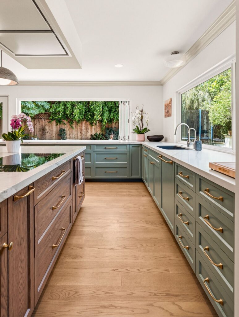 Allied Gardens kitchen addition with green shaker perimeter cabinets, a wood island cooktop and a bi-fold window to the yard