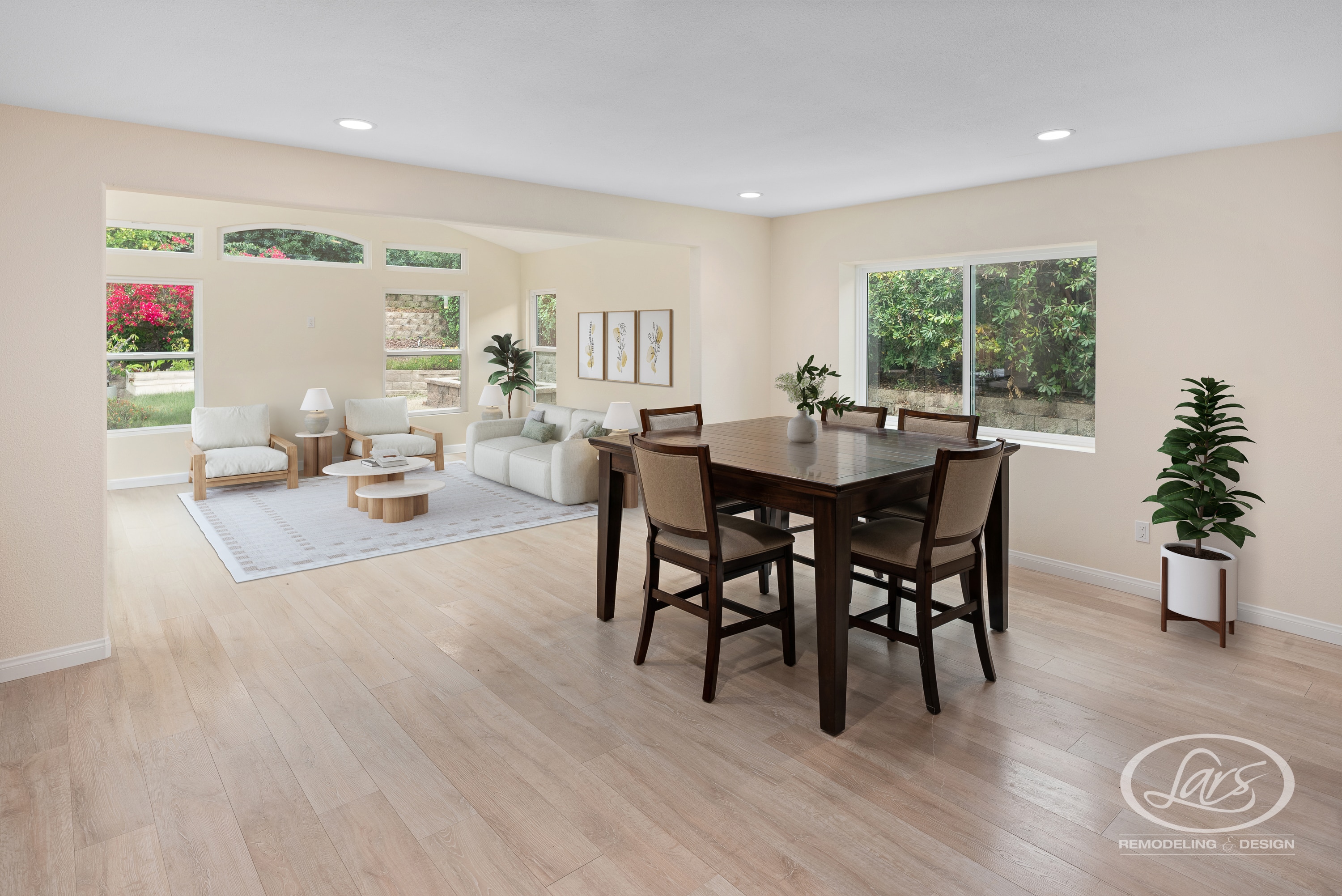 Bright open-concept living and dining room remodeled by Lars Remodeling & Design with light wood flooring, large windows, and modern furnishings.